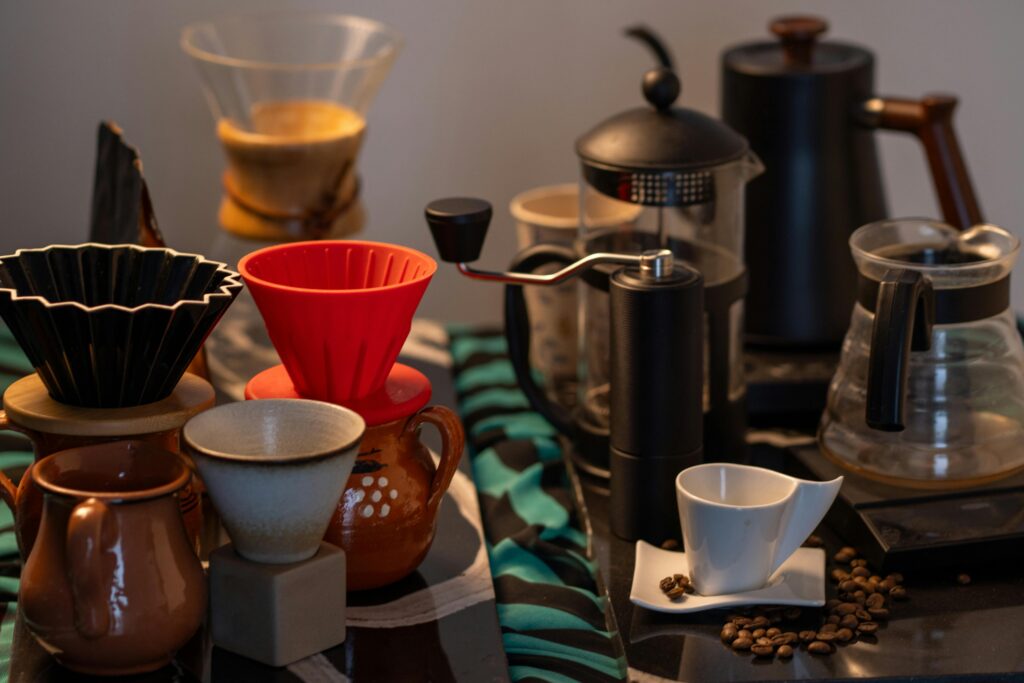 Explore an array of coffee brewing tools including drippers, grinders, and cups, ideal for crafting specialty coffee at home.